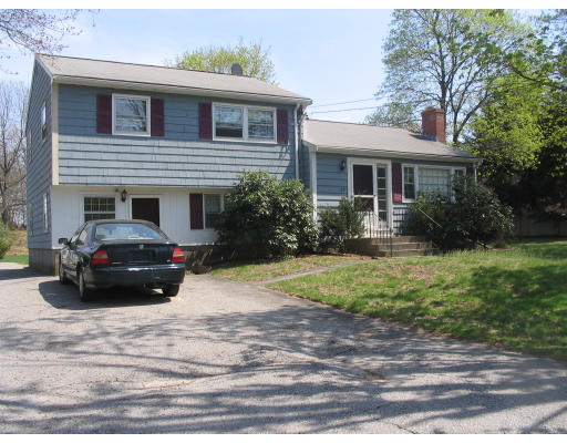 27 Chamberlain Road Chelmsford, MA 01824 - Photo 3 of 11 a car parked in front of a house