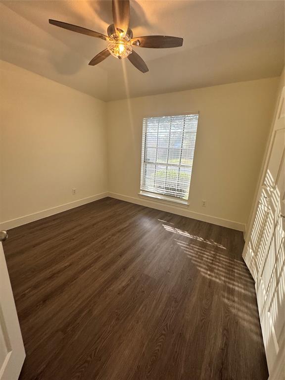 8104 Sebastian Frisco, TX 75035 - Photo 8 of 16 Unfurnished bedroom with dark wood finished floors and a ceiling fan
