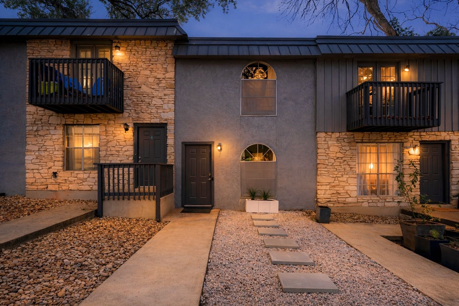 1912 Lightsey Road, Unit 5 Austin, TX 78704 - Photo 1 of 1 View of front facade featuring a balcony, stone siding, and stucco siding