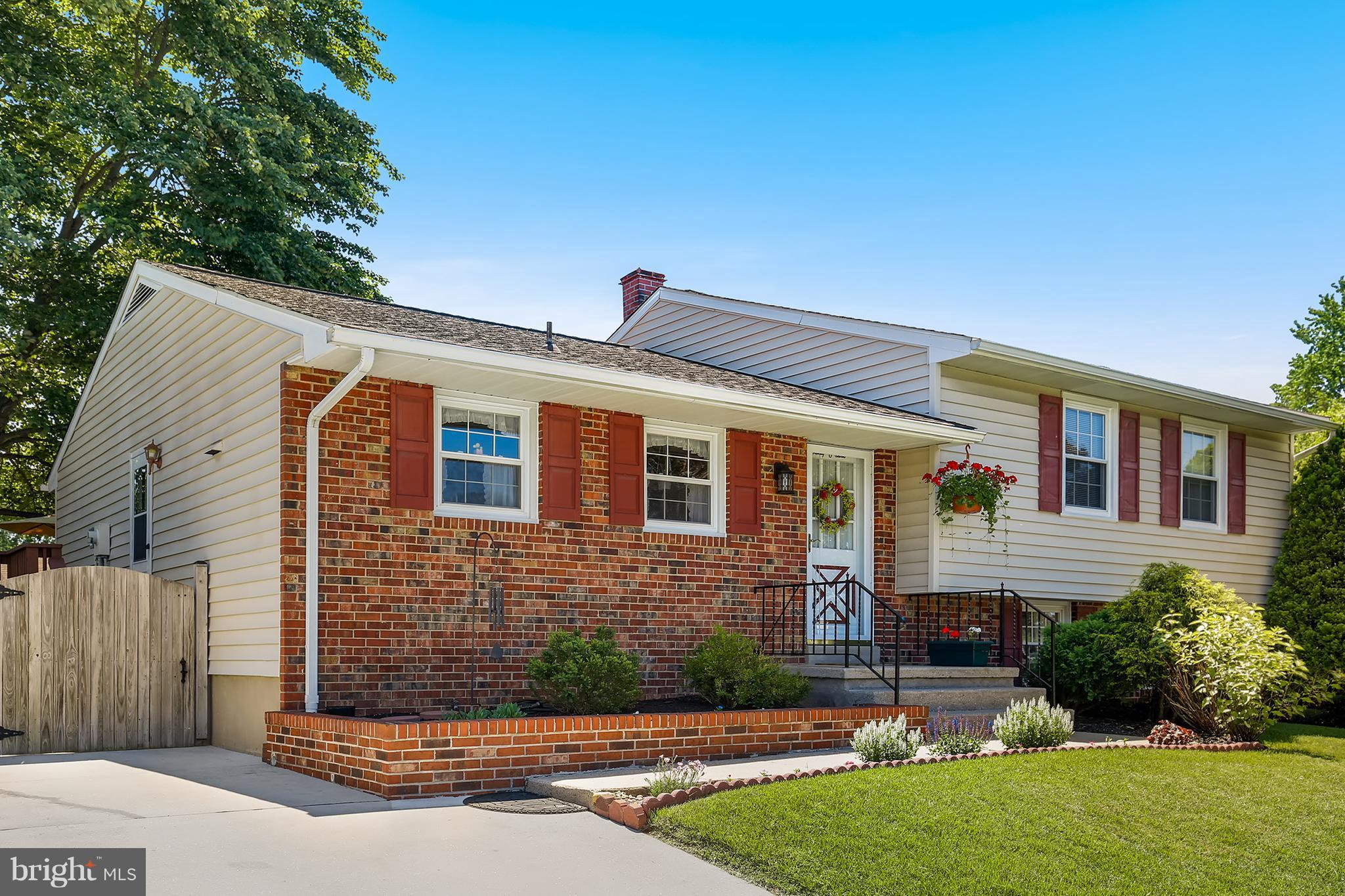 9007 Kilbride Road Baltimore, MD 21236 - Photo 2 of 30 a front view of a house with a yard