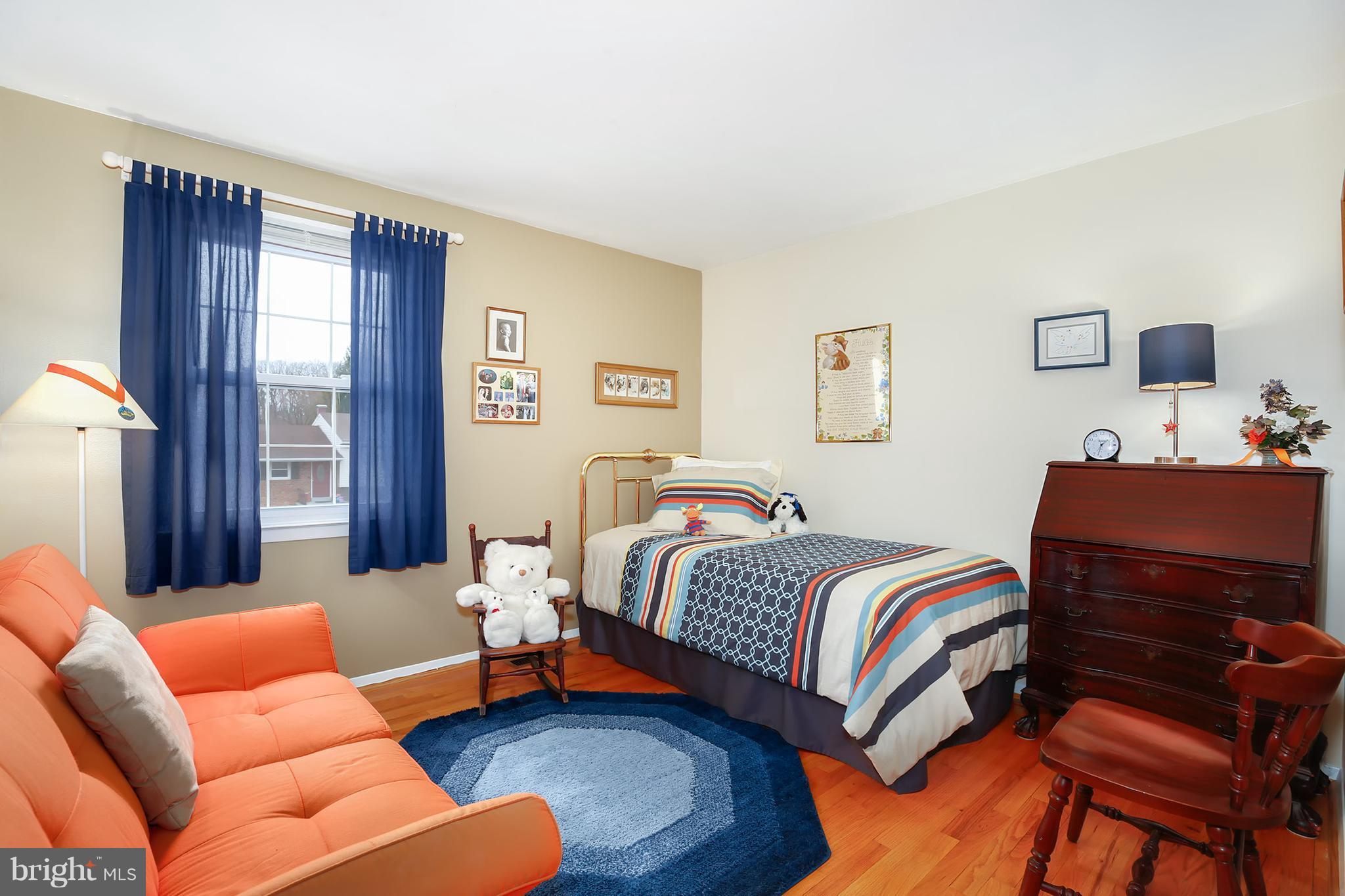 9007 Kilbride Road Baltimore, MD 21236 - Photo 12 of 30 a bedroom with a bed couch and window