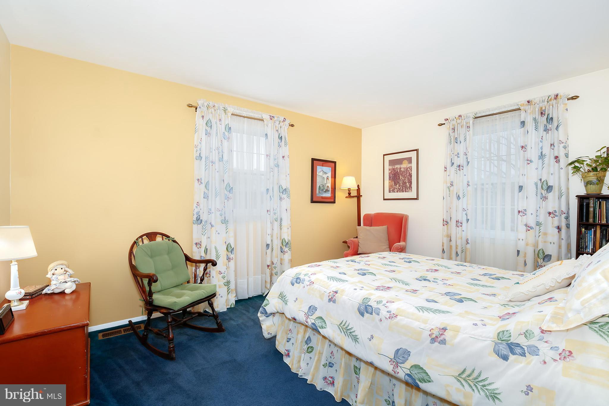 9007 Kilbride Road Baltimore, MD 21236 - Photo 13 of 30 a bedroom with a bed a table and chair