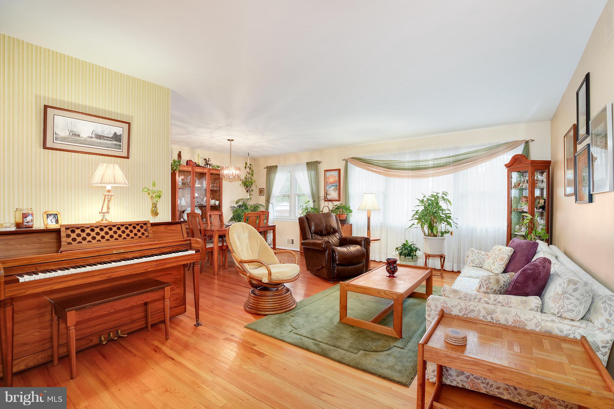 9007 Kilbride Road Baltimore, MD 21236 - Photo 3 of 30 a living room with furniture fireplace and a large window