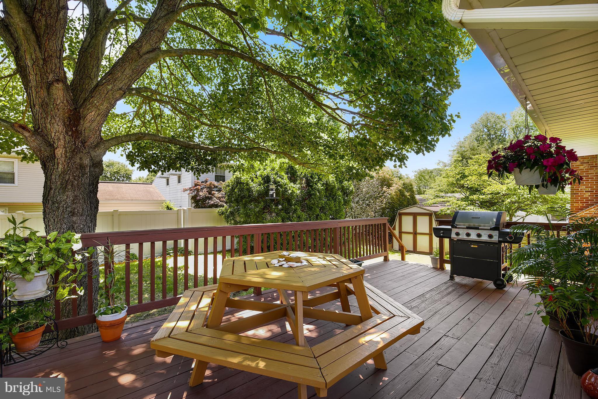 9007 Kilbride Road Baltimore, MD 21236 - Photo 26 of 30 a view of a chairs and table on the wooden deck