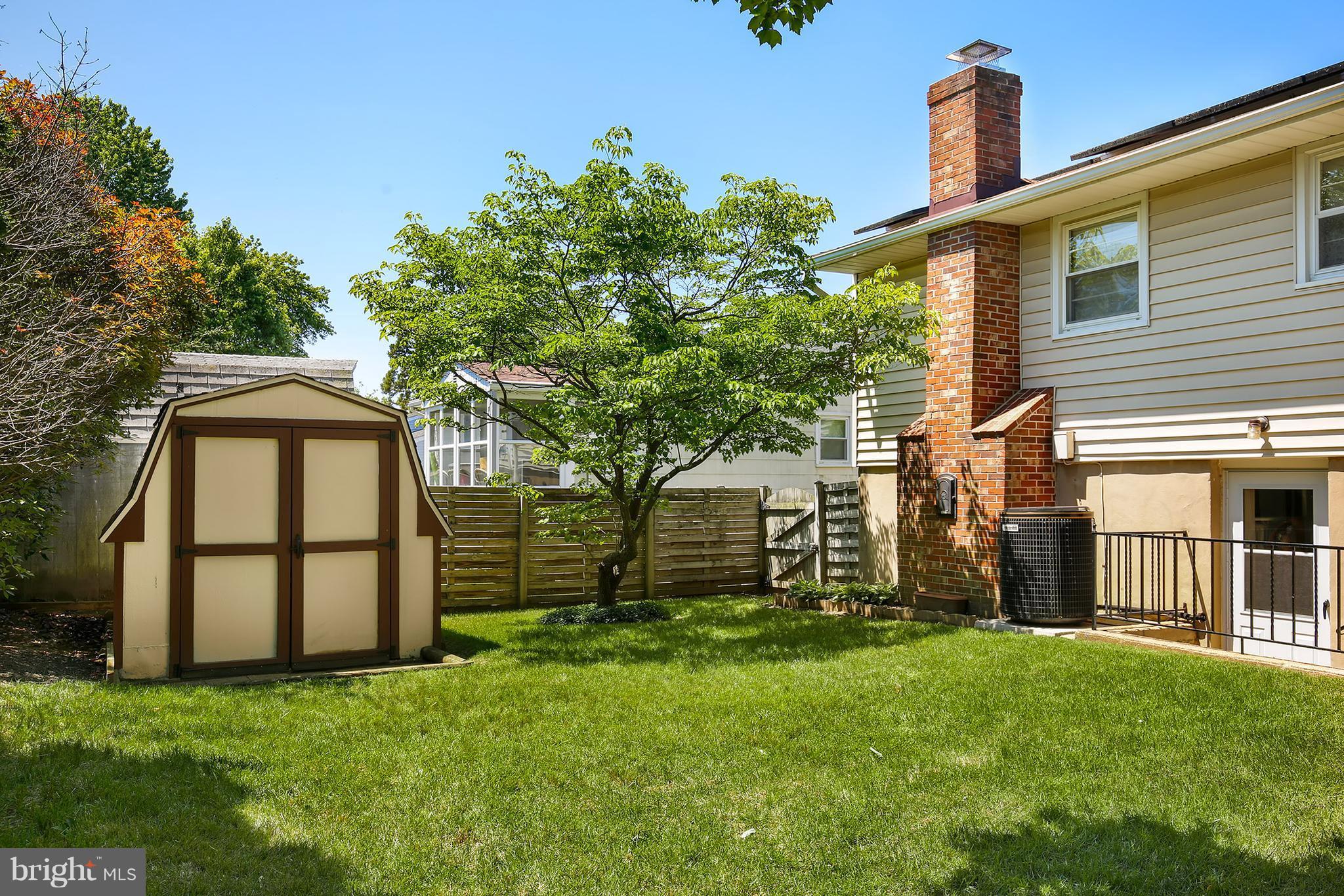 9007 Kilbride Road Baltimore, MD 21236 - Photo 29 of 30 a front view of a house with a yard and garage