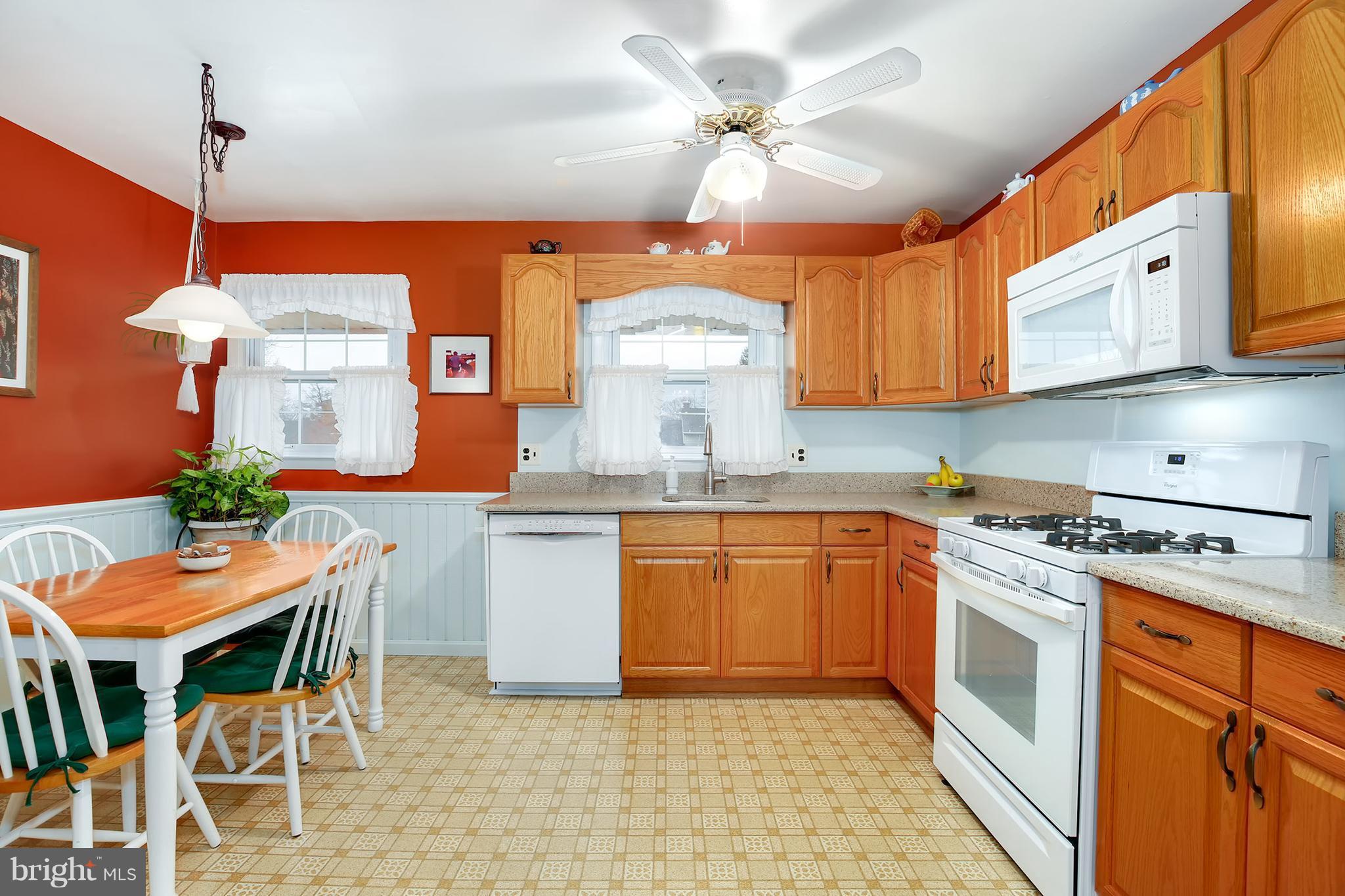 9007 Kilbride Road Baltimore, MD 21236 - Photo 8 of 30 a kitchen with stainless steel appliances granite countertop a stove a sink and a refrigerator