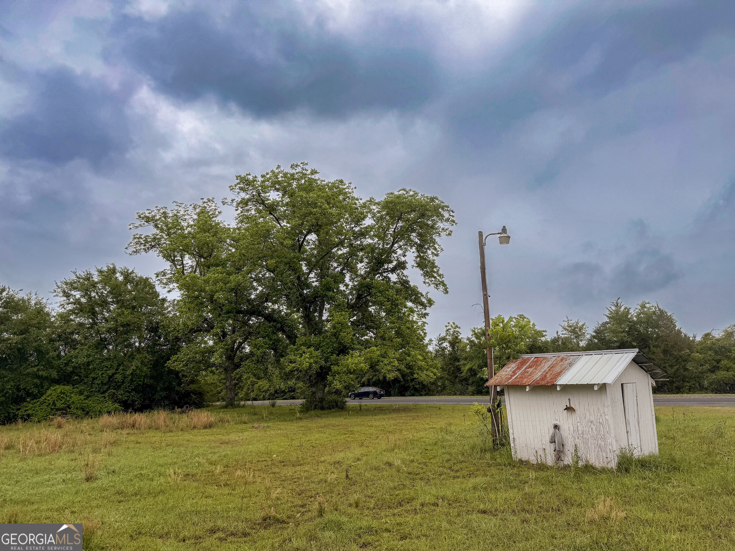 3925 Highway 441 Rentz, GA 31075 - Photo 3 of 16 a backyard of a house with lots of green space