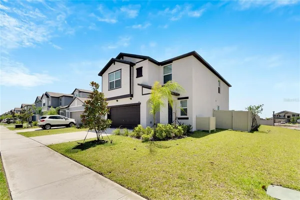 a front view of house with yard outdoor seating and entertaining space