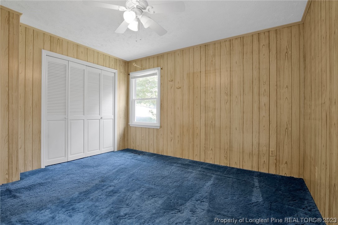 325 McIntosh Road Carthage, NC 28327 - Photo 18 of 30 a view of an empty room with wooden floor and a window