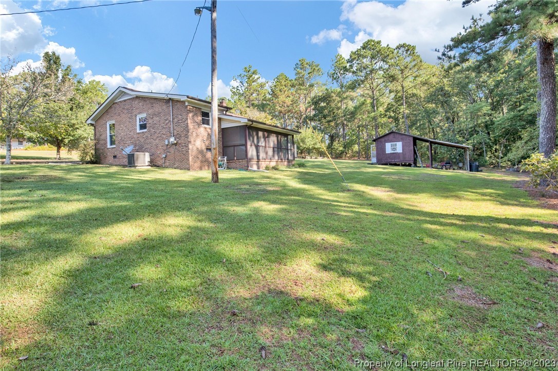 325 McIntosh Road Carthage, NC 28327 - Photo 22 of 30 a front view of house with yard and trees