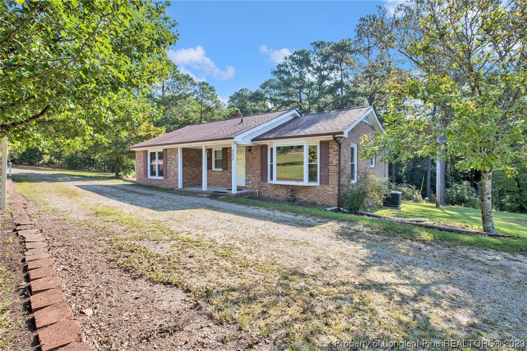 325 McIntosh Road Carthage, NC 28327 - Photo 28 of 30 a house view with a garden space