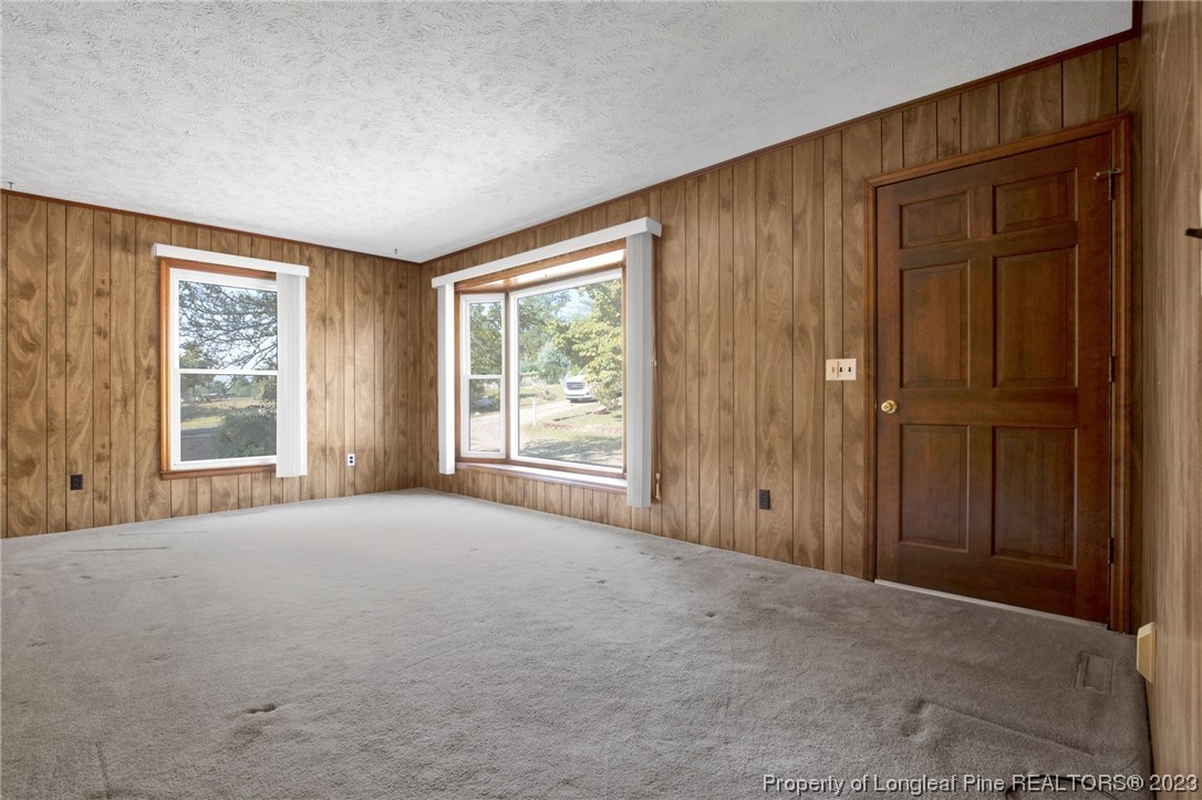 325 McIntosh Road Carthage, NC 28327 - Photo 3 of 30 an empty room with windows