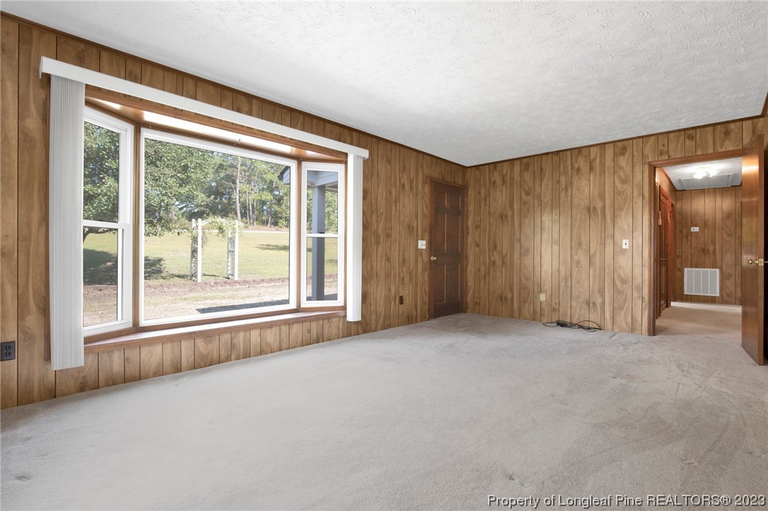 325 McIntosh Road Carthage, NC 28327 - Photo 4 of 30 a view of an empty room with a window
