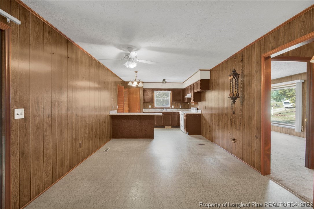 325 McIntosh Road Carthage, NC 28327 - Photo 7 of 30 a view of kitchen with wooden cabinet