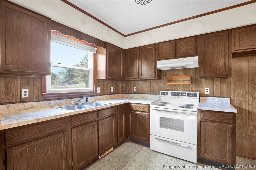 325 McIntosh Road Carthage, NC 28327 - Photo 10 of 30 a kitchen with a sink stove and cabinets