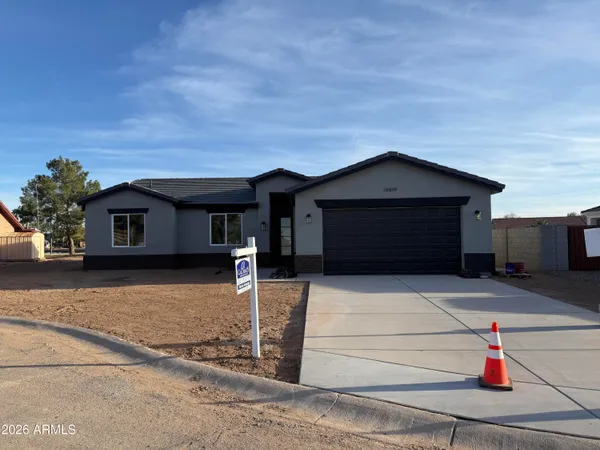 a front view of a house with yard