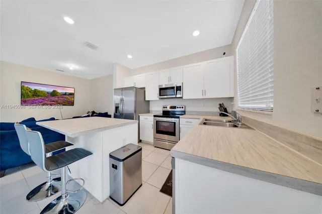 a large kitchen with cabinets
