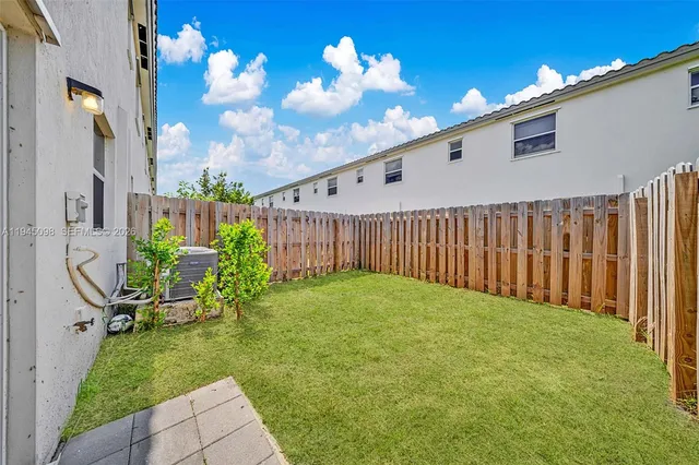 a view of a backyard of the house