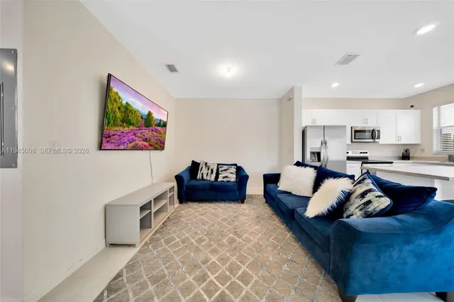 a living room with furniture and a couch