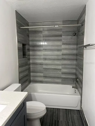 a bathroom with a shower and a toilet