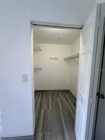 a view of an empty walk in closet
