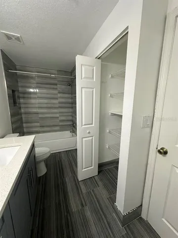 a bathroom with a sink and a shower
