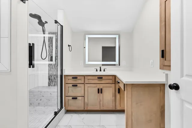 a bathroom with a sink and a mirror