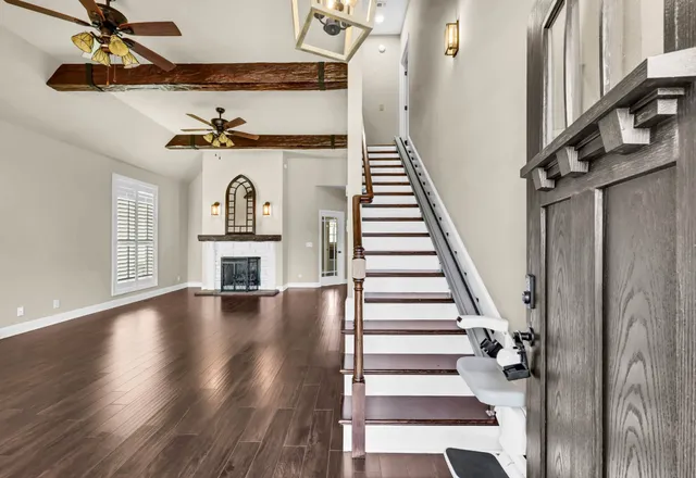 a view of entryway and hall with wooden floor