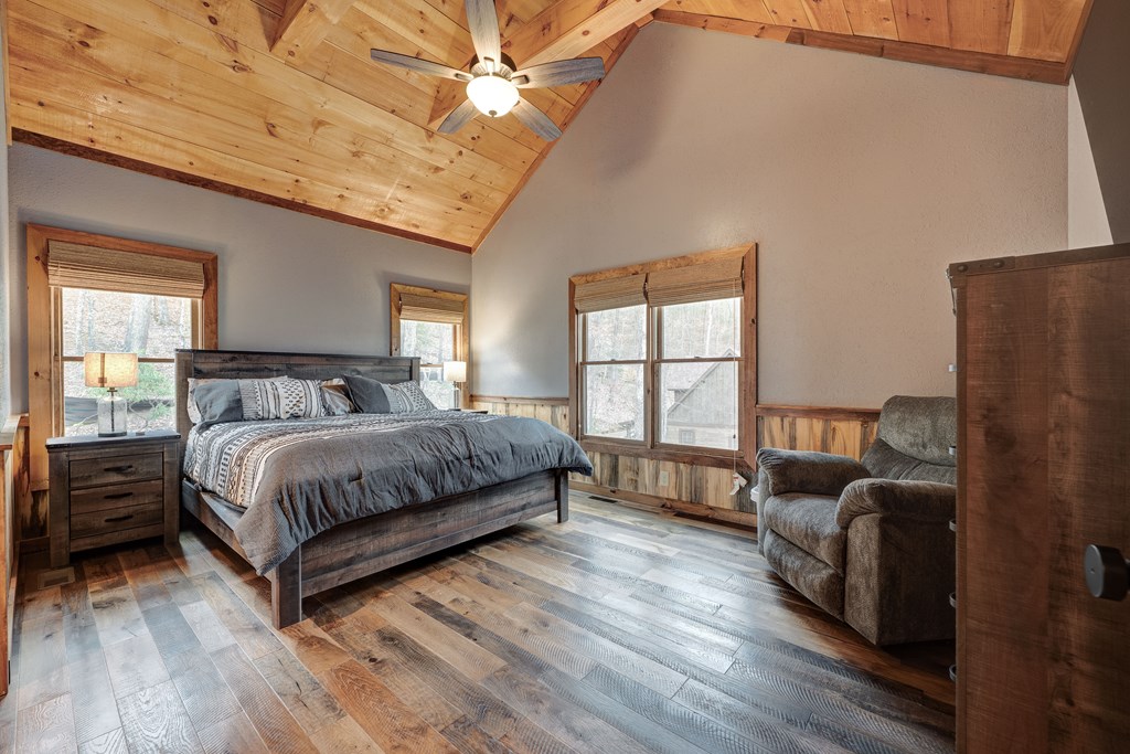1601 Shady Falls Road Blue Ridge, GA 30513 - Photo 35 of 78 a bedroom with a bed couch and window