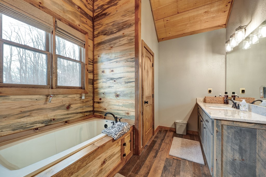 1601 Shady Falls Road Blue Ridge, GA 30513 - Photo 40 of 78 a bath room with a sink and a bath tub