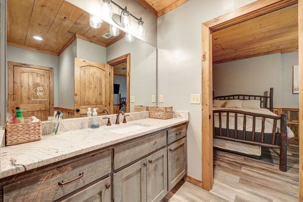 1601 Shady Falls Road Blue Ridge, GA 30513 - Photo 56 of 78 a bathroom with a sink and a mirror