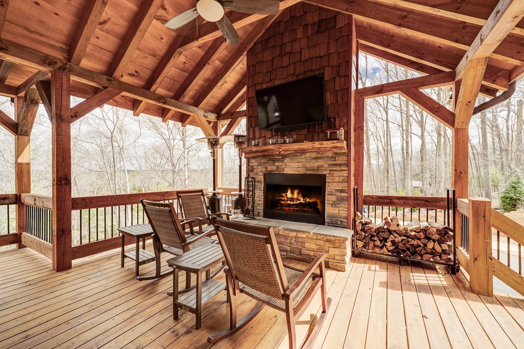1601 Shady Falls Road Blue Ridge, GA 30513 - Photo 61 of 78 a view of a chairs and table on the deck
