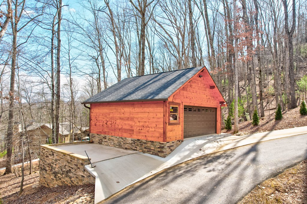 1601 Shady Falls Road Blue Ridge, GA 30513 - Photo 70 of 78 a backyard of a house with oven and outdoor seating
