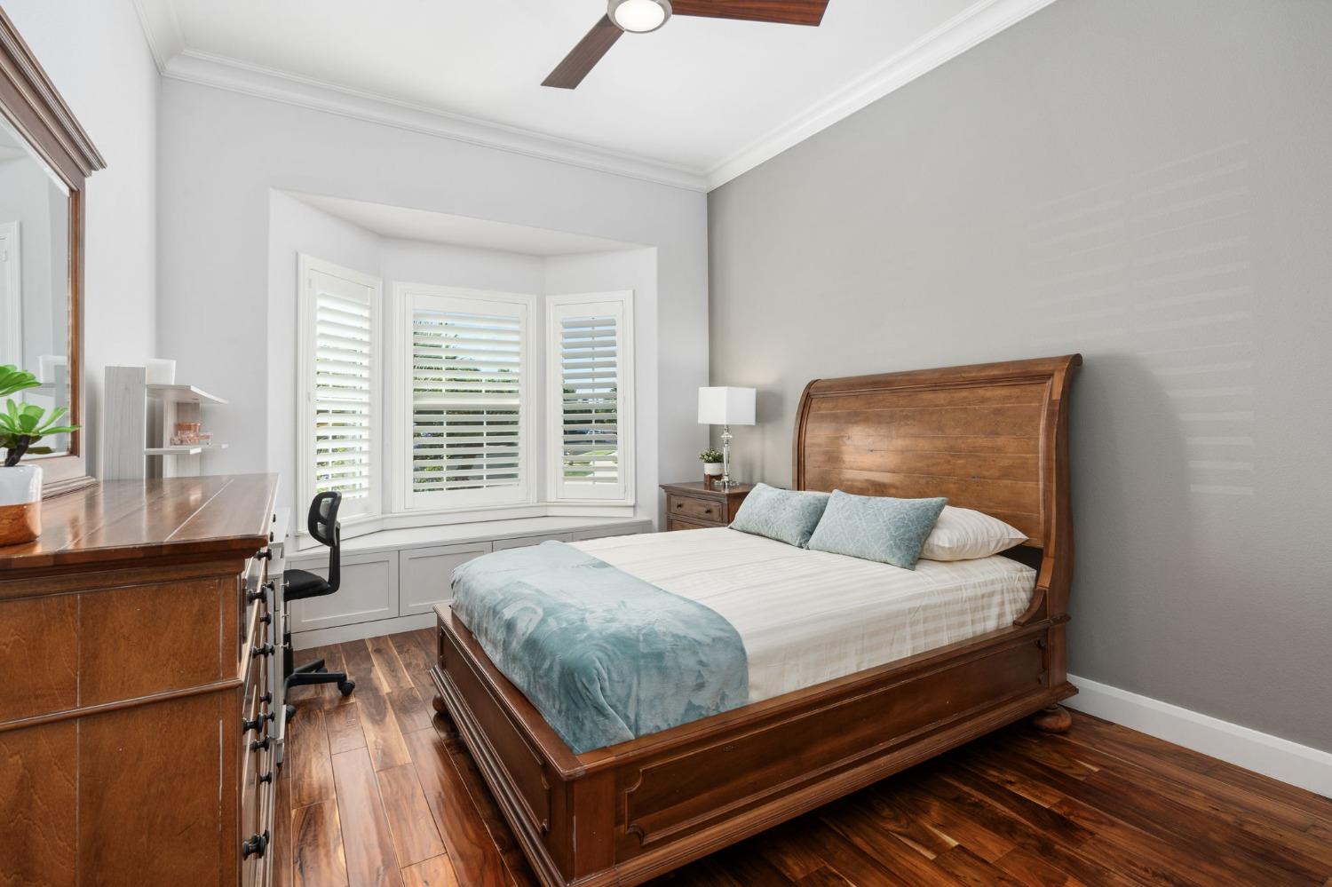 415 Heritage Avenue Clovis, CA 93619 - Photo 15 of 56 a bedroom with a bed and a window