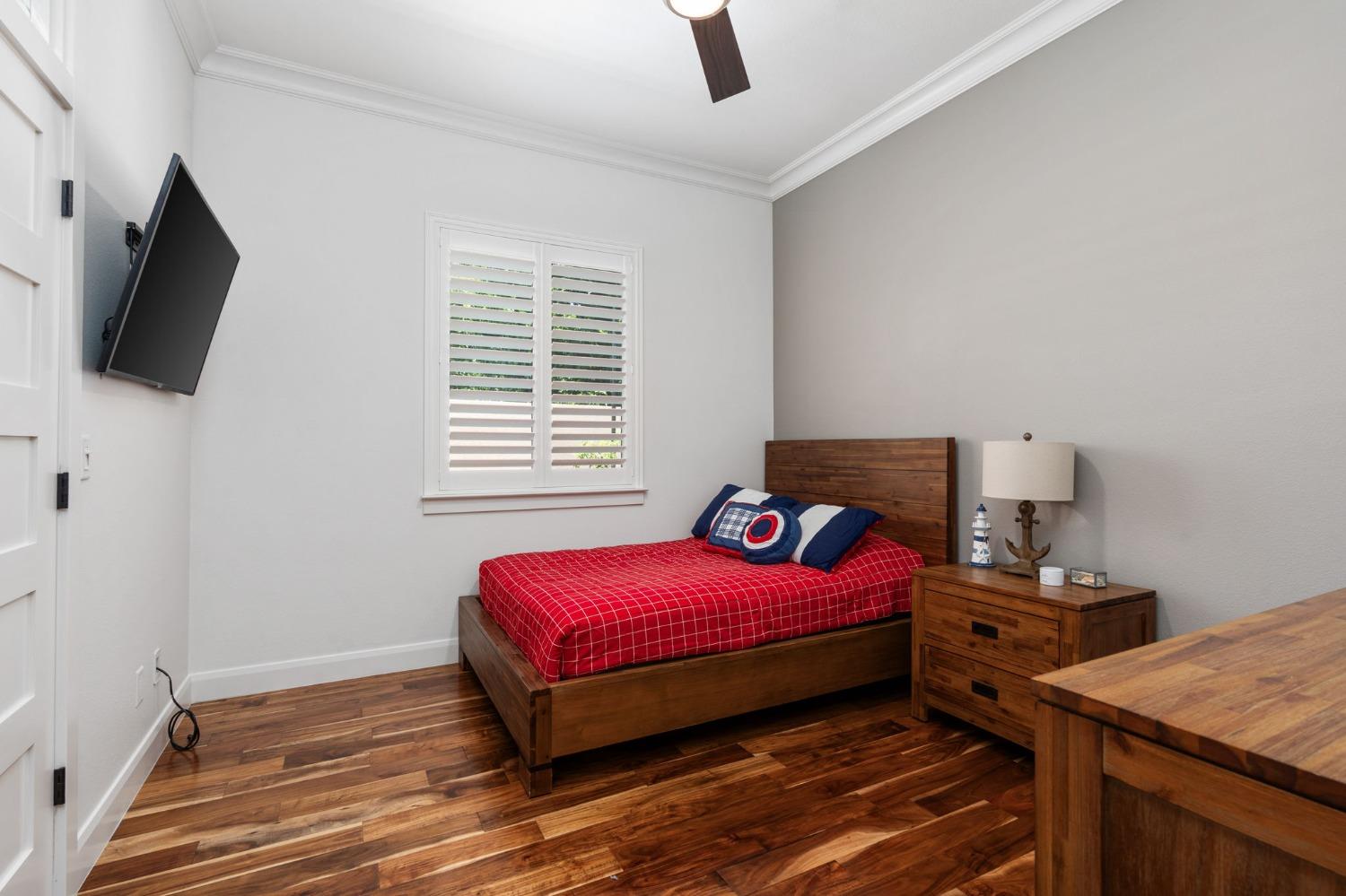 415 Heritage Avenue Clovis, CA 93619 - Photo 19 of 56 a bedroom with a bed and a flat screen tv