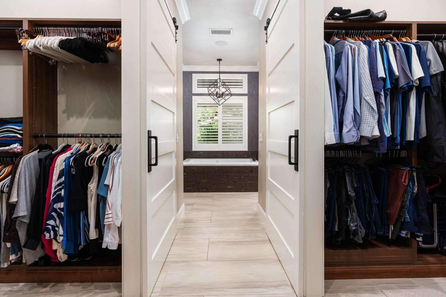 415 Heritage Avenue Clovis, CA 93619 - Photo 22 of 56 a view of walk in closet with clothes and shoes