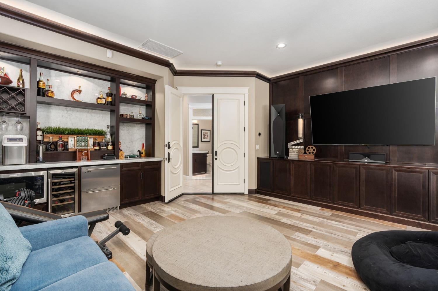 415 Heritage Avenue Clovis, CA 93619 - Photo 27 of 56 a living room with stainless steel appliances furniture and a flat screen tv