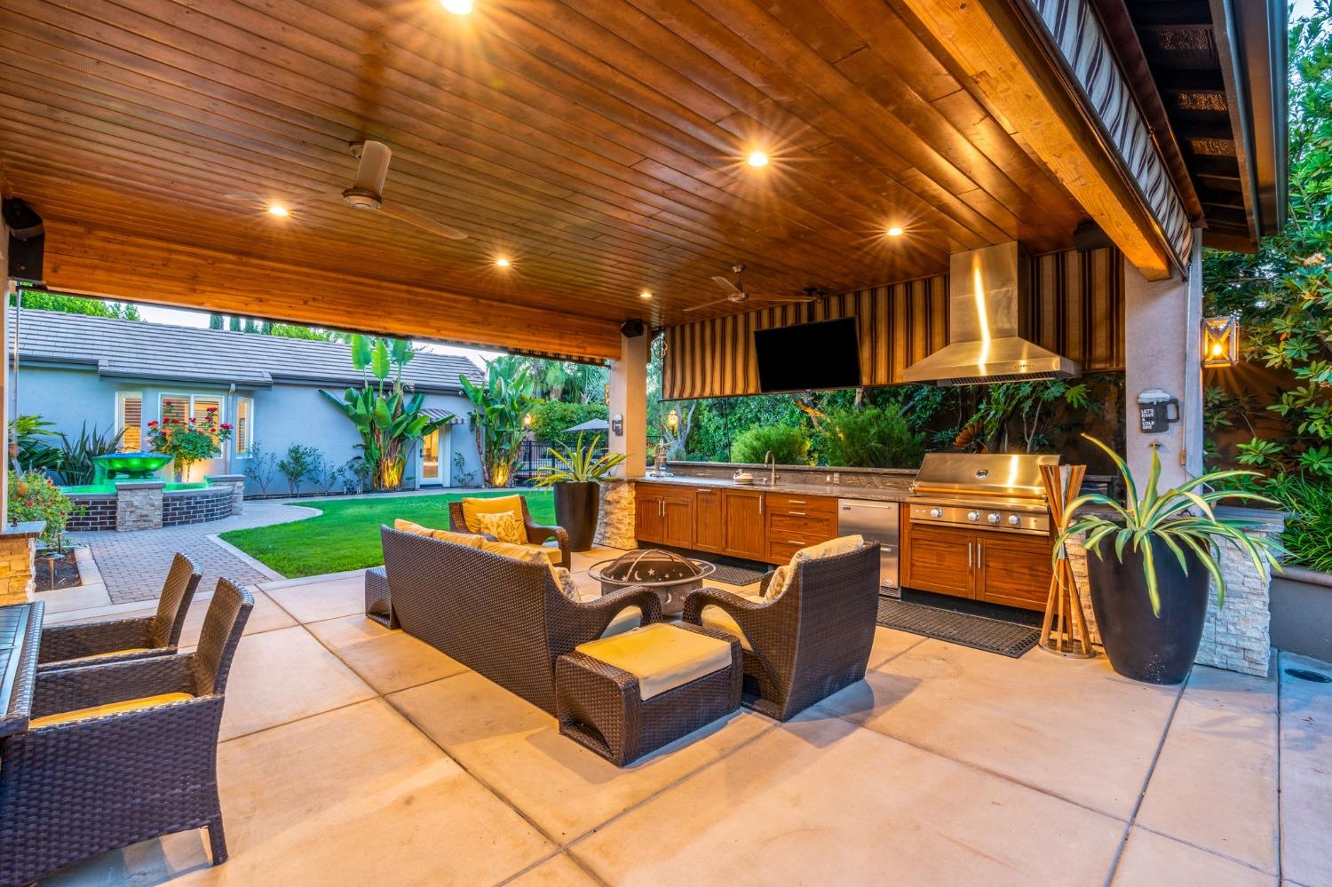 415 Heritage Avenue Clovis, CA 93619 - Photo 30 of 56 a outdoor space with patio furniture and garden