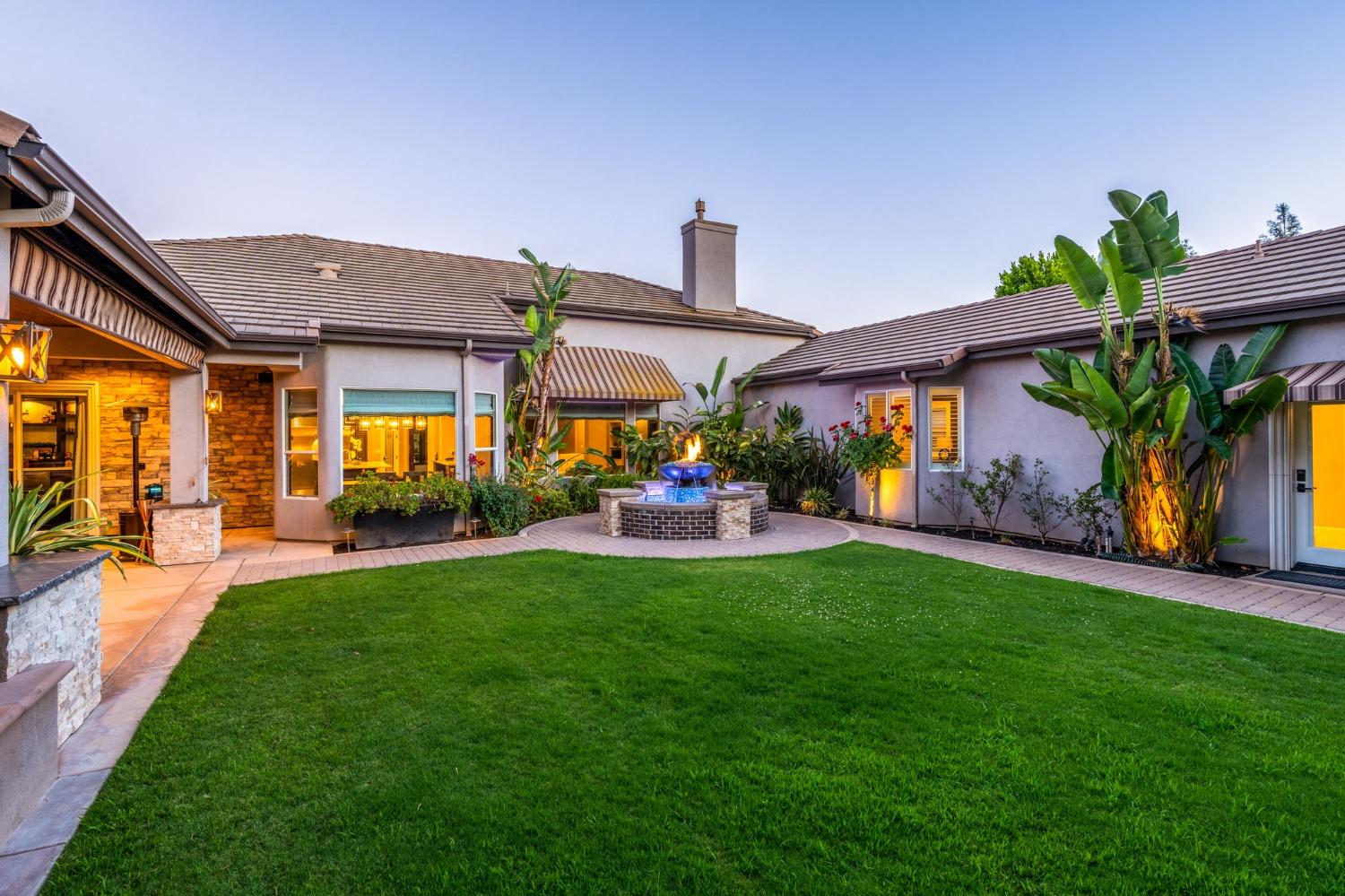 415 Heritage Avenue Clovis, CA 93619 - Photo 35 of 56 a front view of house with yard and outdoor seating
