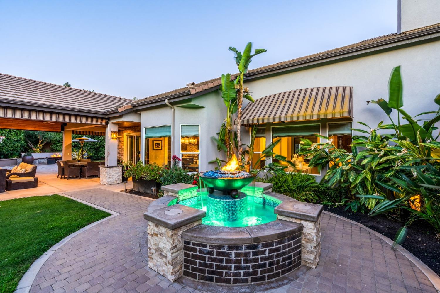 415 Heritage Avenue Clovis, CA 93619 - Photo 37 of 56 a front view of a house with garden