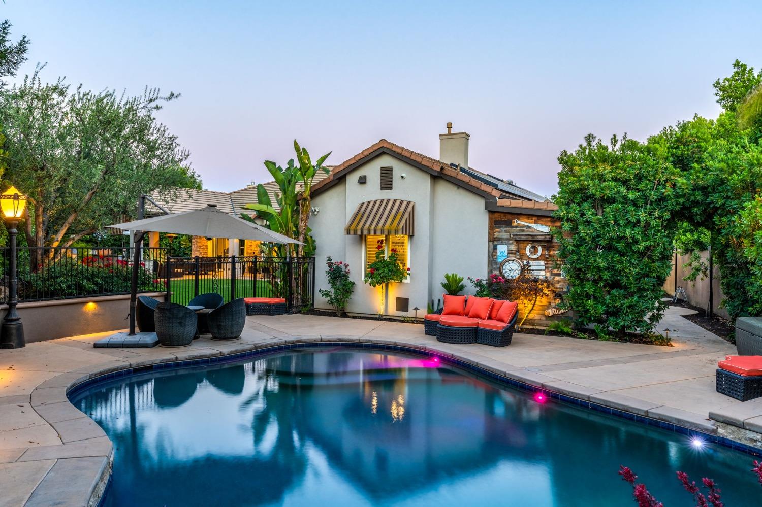 415 Heritage Avenue Clovis, CA 93619 - Photo 39 of 56 a view of swimming pool with outdoor seating and plants
