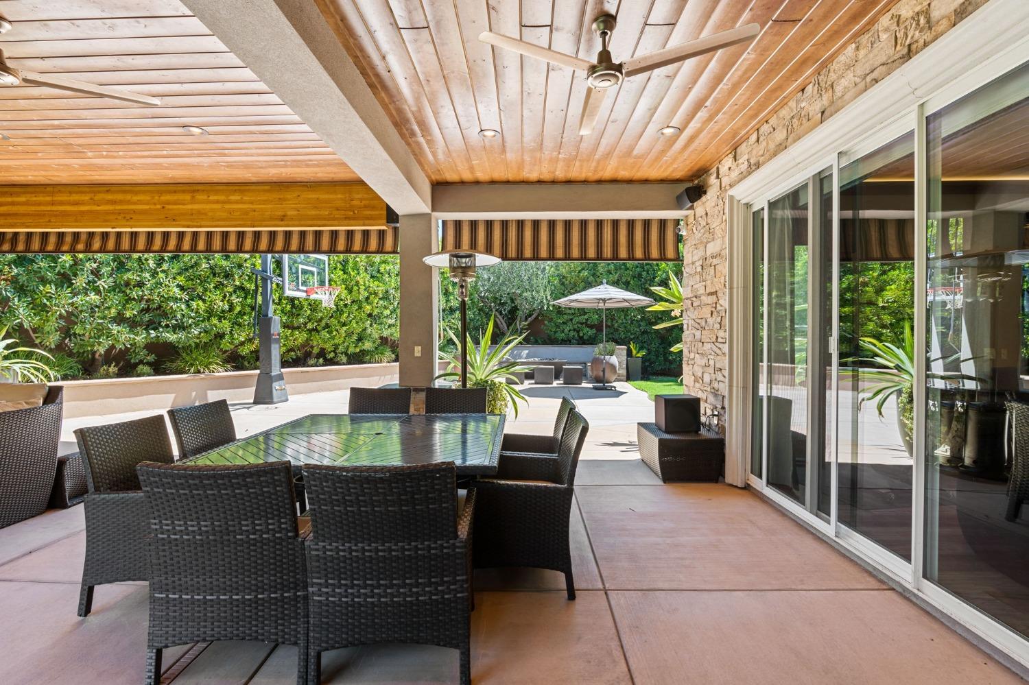 415 Heritage Avenue Clovis, CA 93619 - Photo 44 of 56 a dining room with furniture and floor to ceiling window