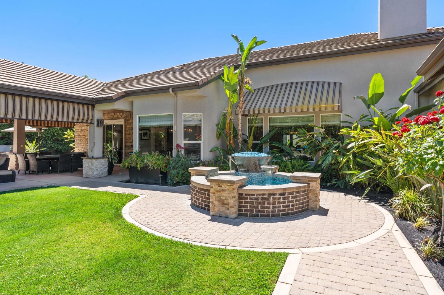 415 Heritage Avenue Clovis, CA 93619 - Photo 48 of 56 a view of a house with backyard and sitting area
