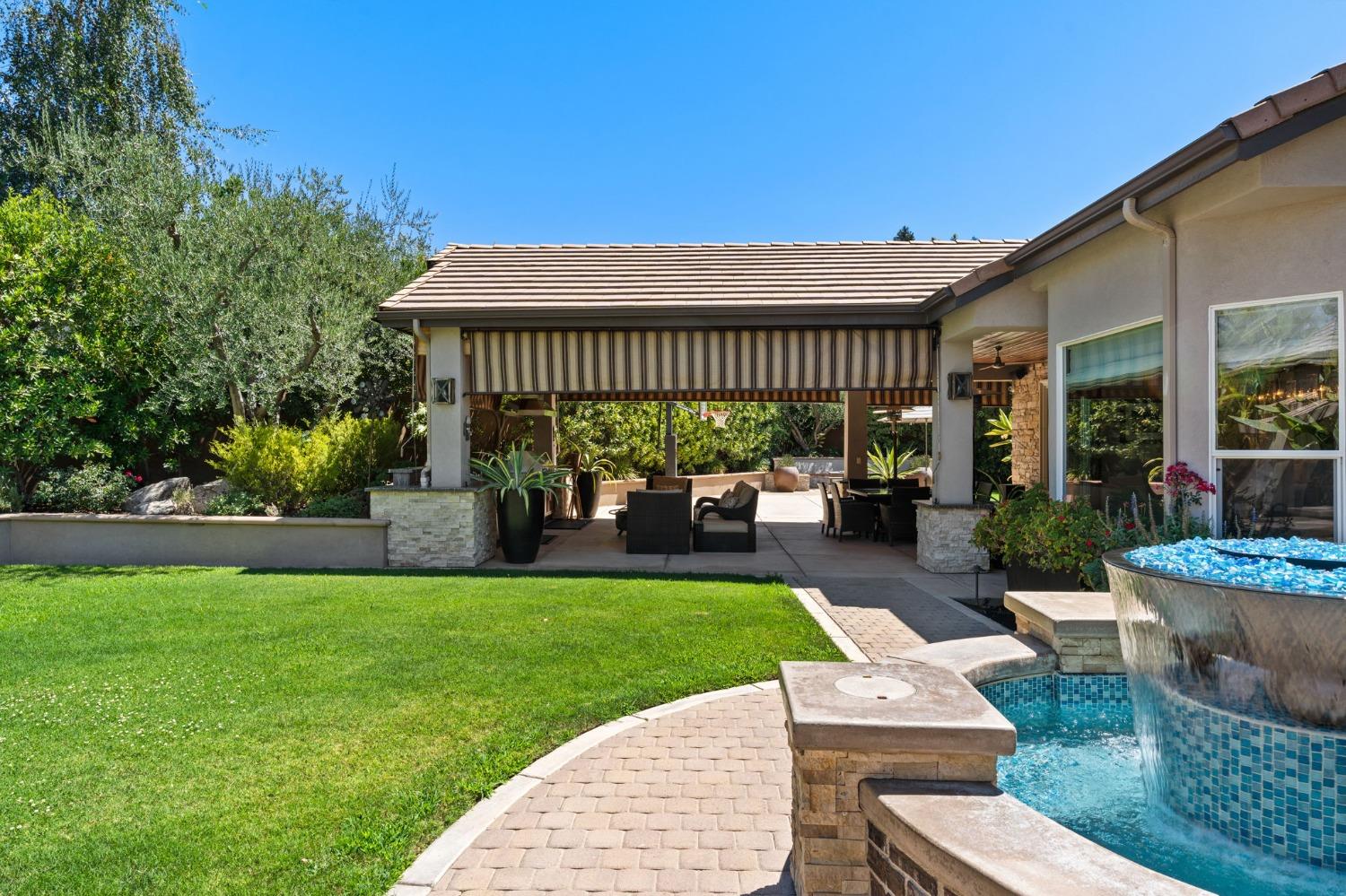 415 Heritage Avenue Clovis, CA 93619 - Photo 49 of 56 a view of a house with furniture and garden