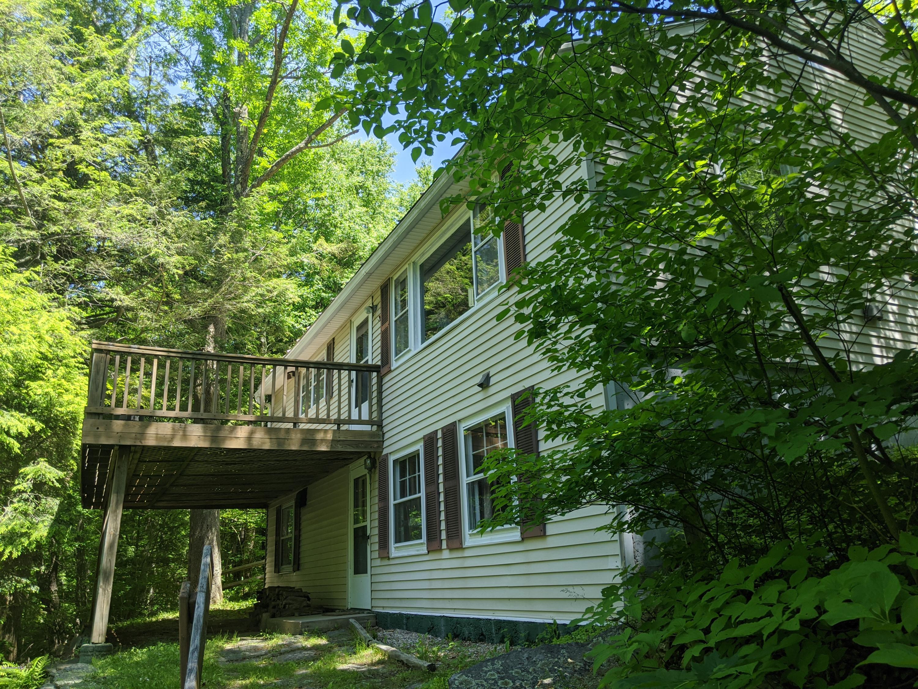 3626 Jacobs Ladder Road Becket, MA 01223 - Photo 2 of 56 a view of a house with a small deck
