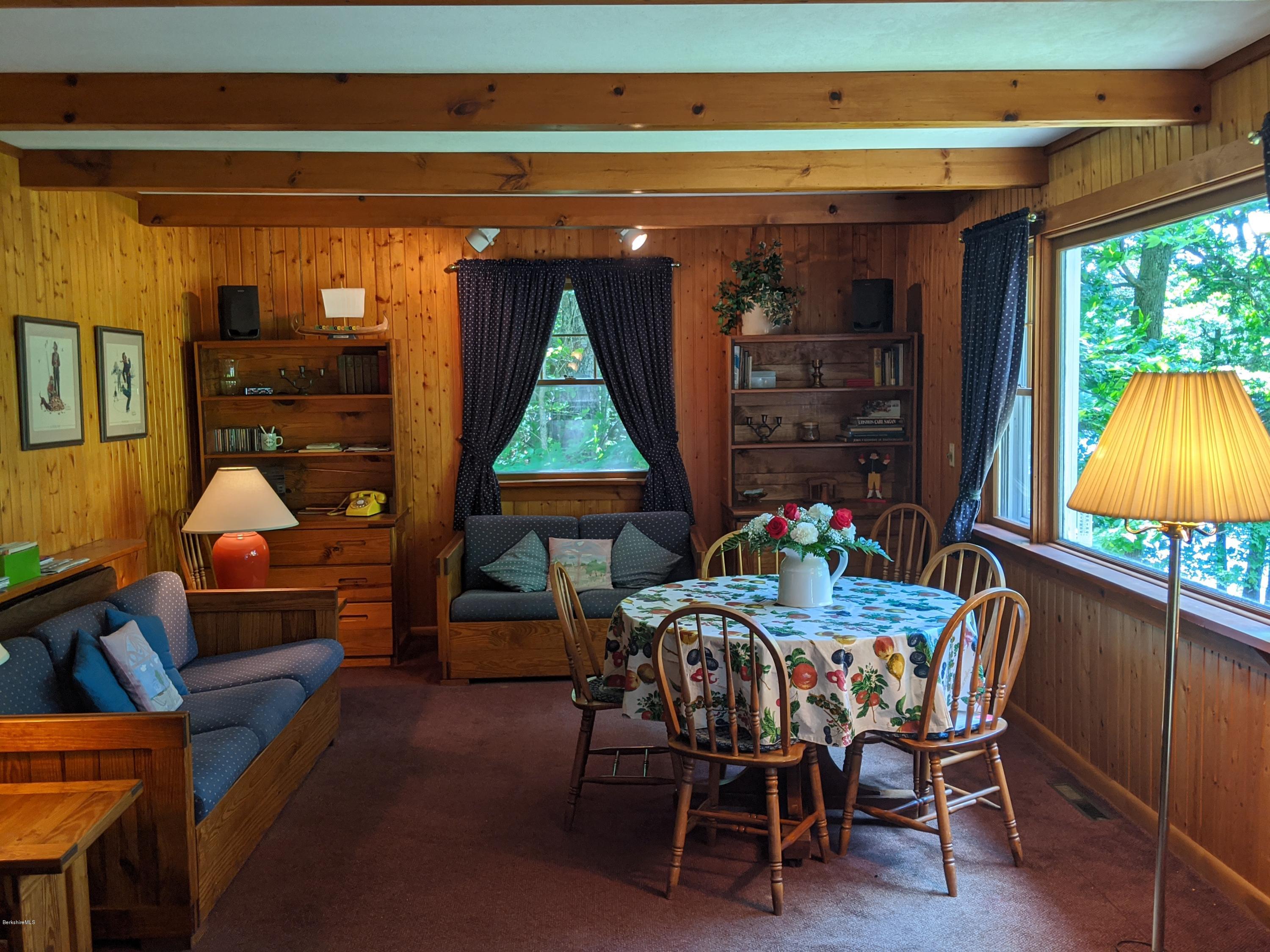 3626 Jacobs Ladder Road Becket, MA 01223 - Photo 17 of 56 a dining room with furniture and a window