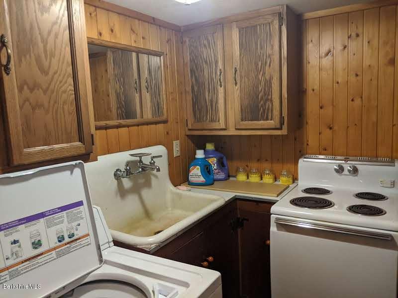 3626 Jacobs Ladder Road Becket, MA 01223 - Photo 35 of 56 a kitchen with a stove and a refrigerator