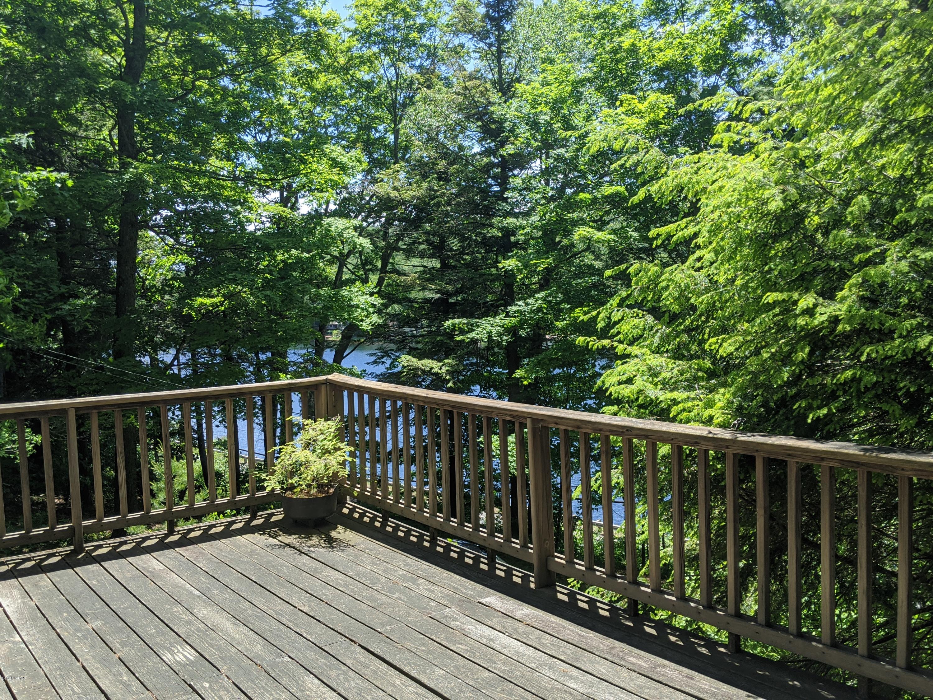 3626 Jacobs Ladder Road Becket, MA 01223 - Photo 5 of 56 a balcony with wooden floor and wooden fence