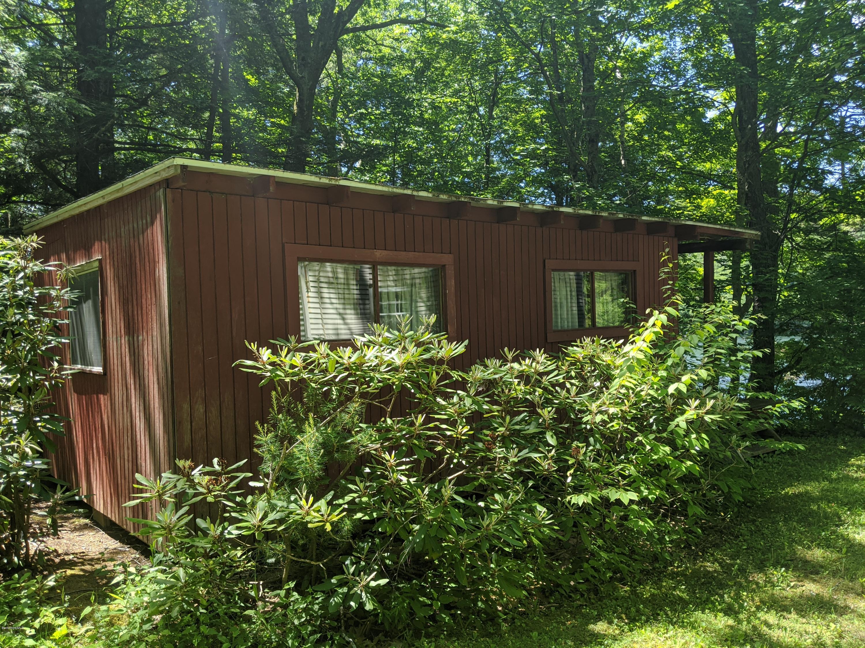 3626 Jacobs Ladder Road Becket, MA 01223 - Photo 42 of 56 a backyard of a house with lots of green space