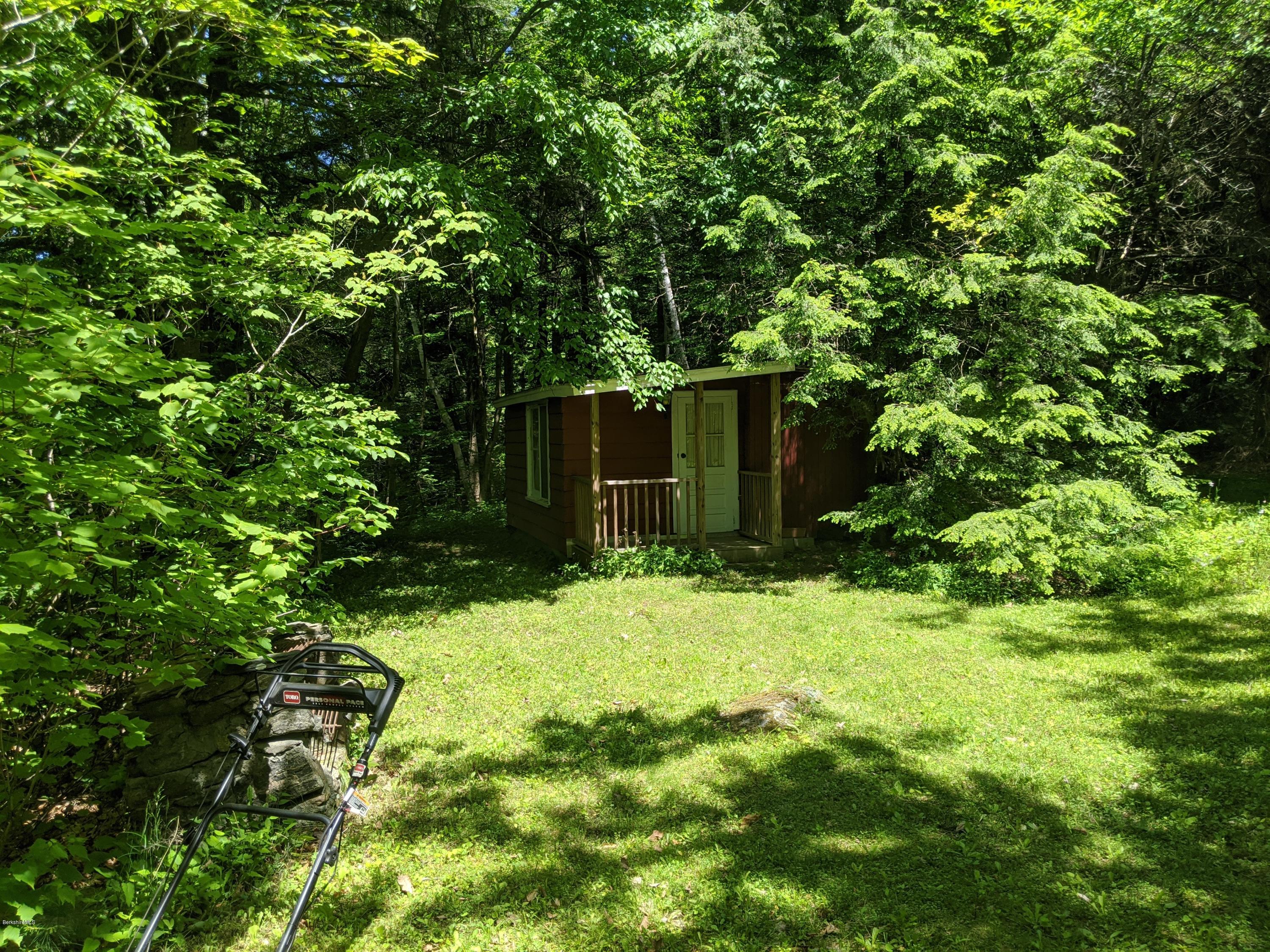3626 Jacobs Ladder Road Becket, MA 01223 - Photo 44 of 56 a backyard of a house with yard and tree